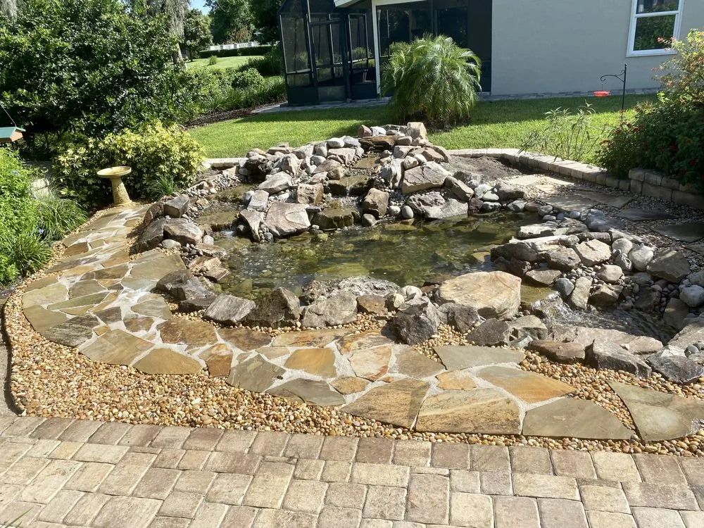 Custom landscape installation for residential properties in De Leon Springs, FL by Aquasam’s Koi Ponds and More