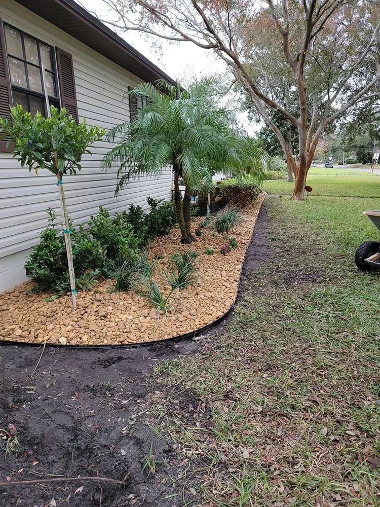 Professional lawn mowing service experts serving TEMPLE TERR, FL - Aquino & son land art