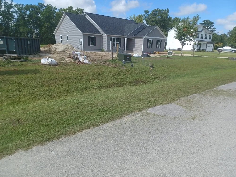 Custom landscape installation with custom design in New Bern, NC by Aragon And White Landscaping