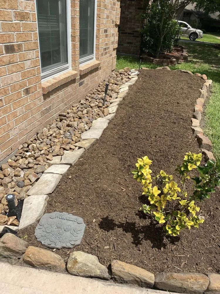 Professional landscape installation with custom design in Houston, TX by Arcos Lawn Care