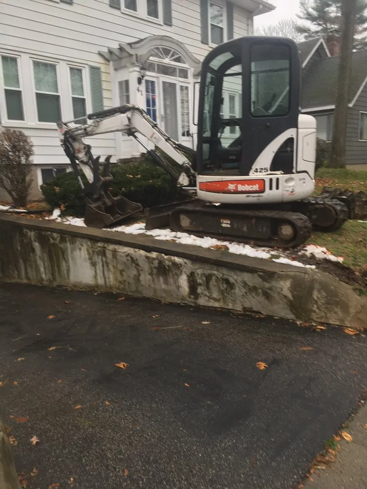 Custom landscape design for residential properties in Dracut, MA by Armstrong General Machinery & Landscaping