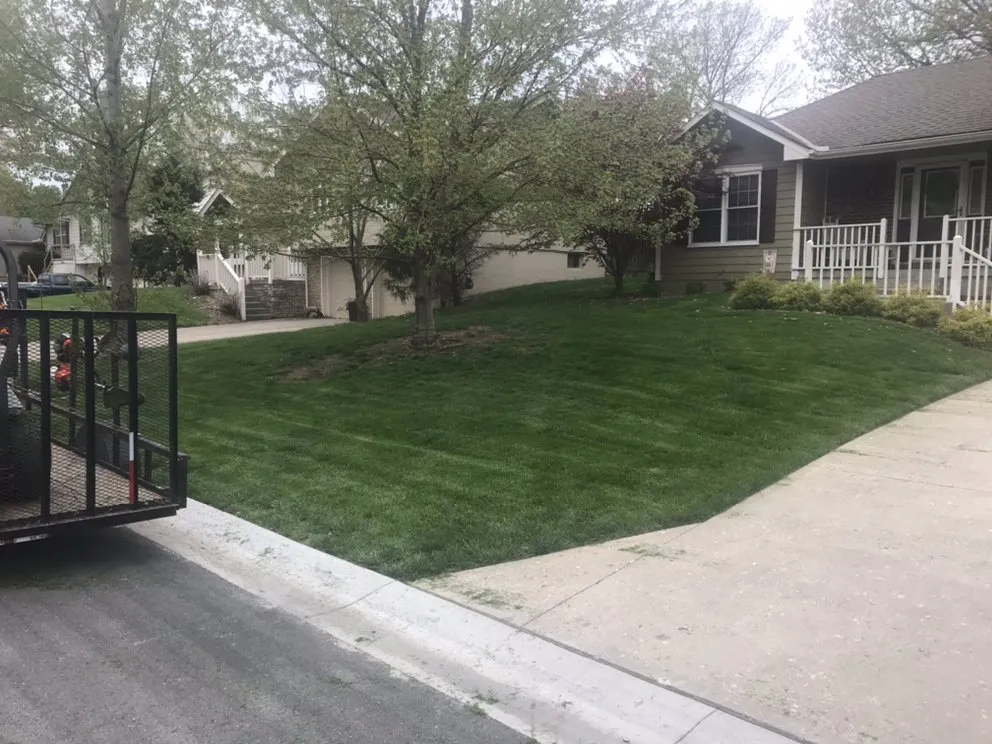 Custom outdoor landscaping in Sugar Creek, MO by Aron & Sons Lawn Care