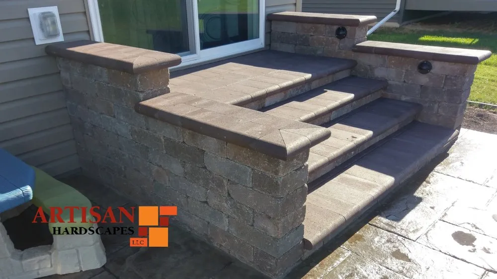 Custom yard cleanup service for year-round maintenance in Fargo, ND by Artisan Hardscapes