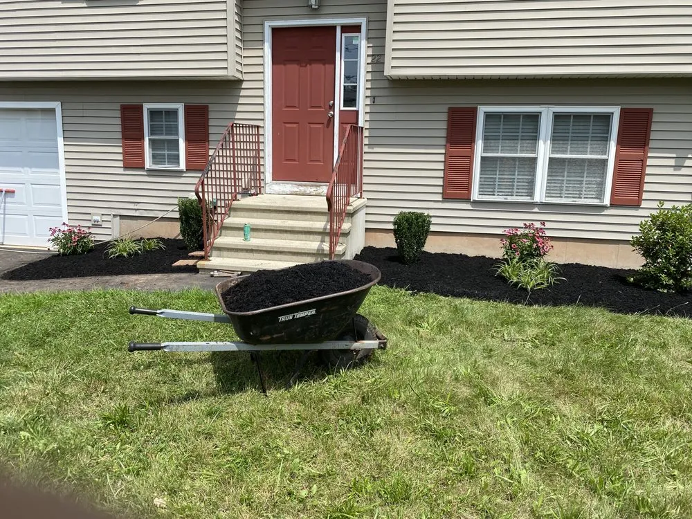 Custom yard cleanup service for homes in Newington, CT by Ashmore & Son Landscaping