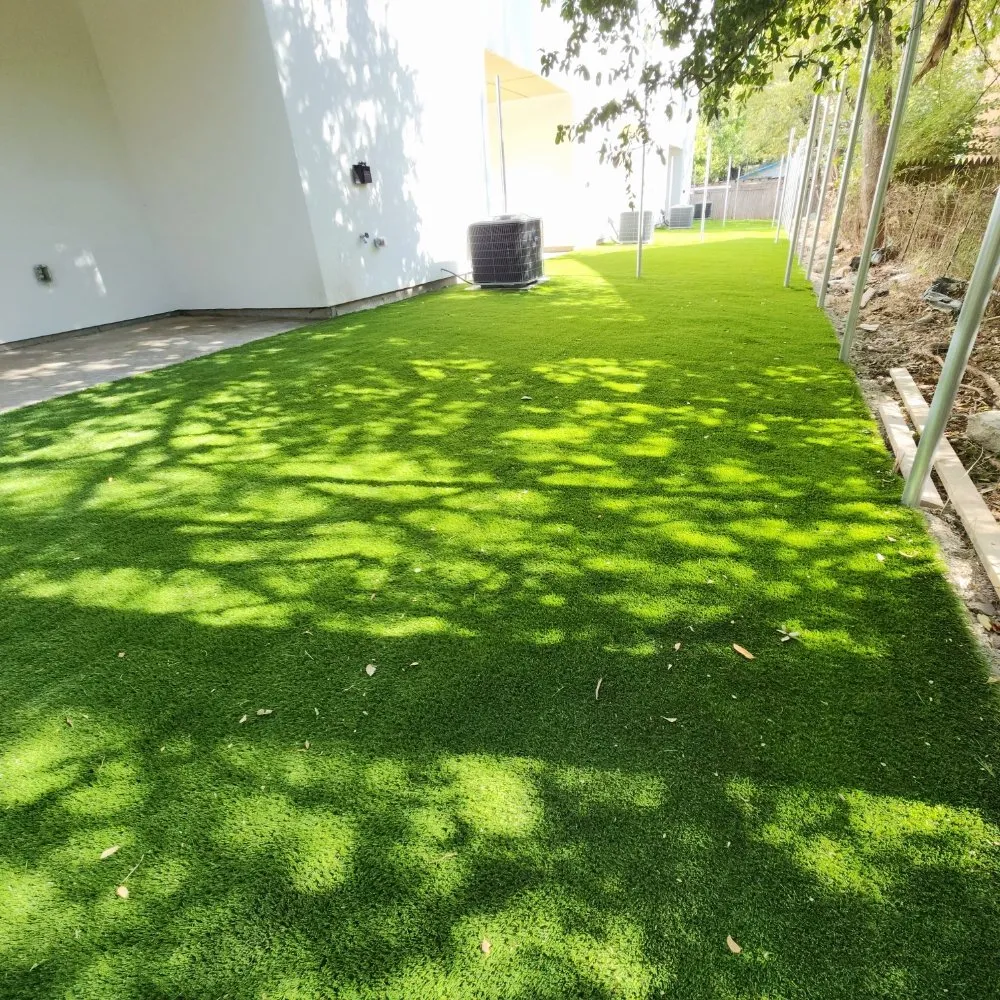 Professional lawn care service for year-round maintenance in Carrollton, TX by B-Bros Synthetic Landscape