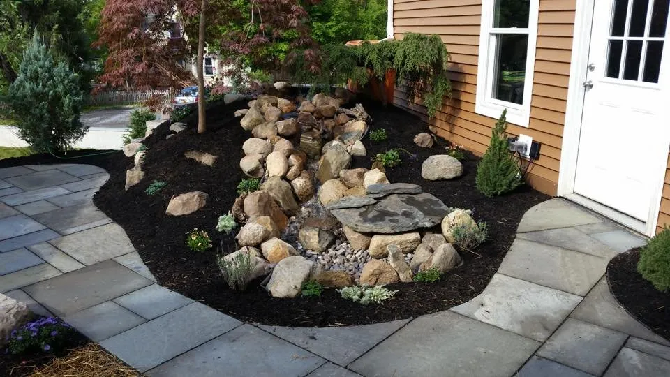 Custom residential landscaping for year-round maintenance across Trumansburg, NY - B-N-R Landscaping
