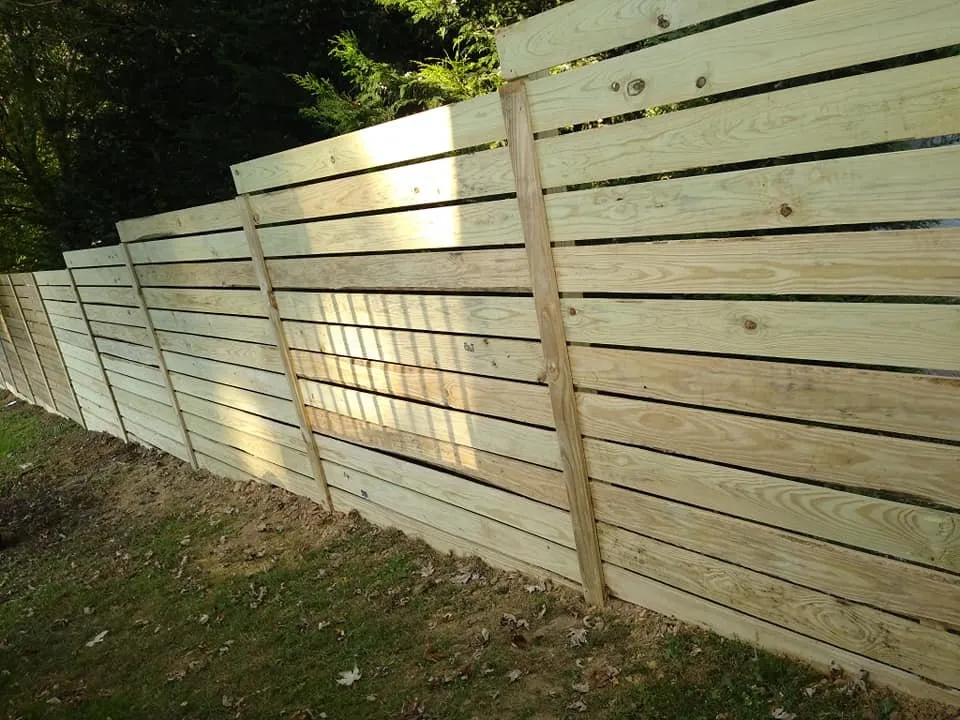 Professional lawn mowing service with custom design in Candler, NC by Babcat Fence and Deck