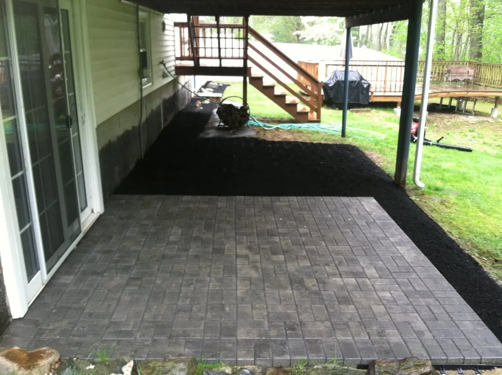 Trusted lawn mowing service for year-round maintenance in Londonderry, NH by Backwoods Landscaping