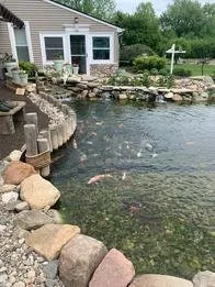 Custom landscape installation in Flint, MI - Backyard Oasis Pond & Garden Center