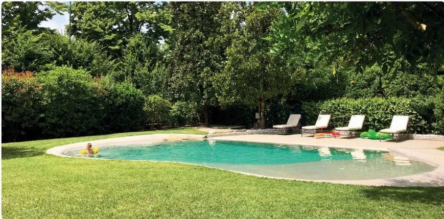 Top-rated garden landscaping with custom design in Whitsett, NC by Barefoot Backyards