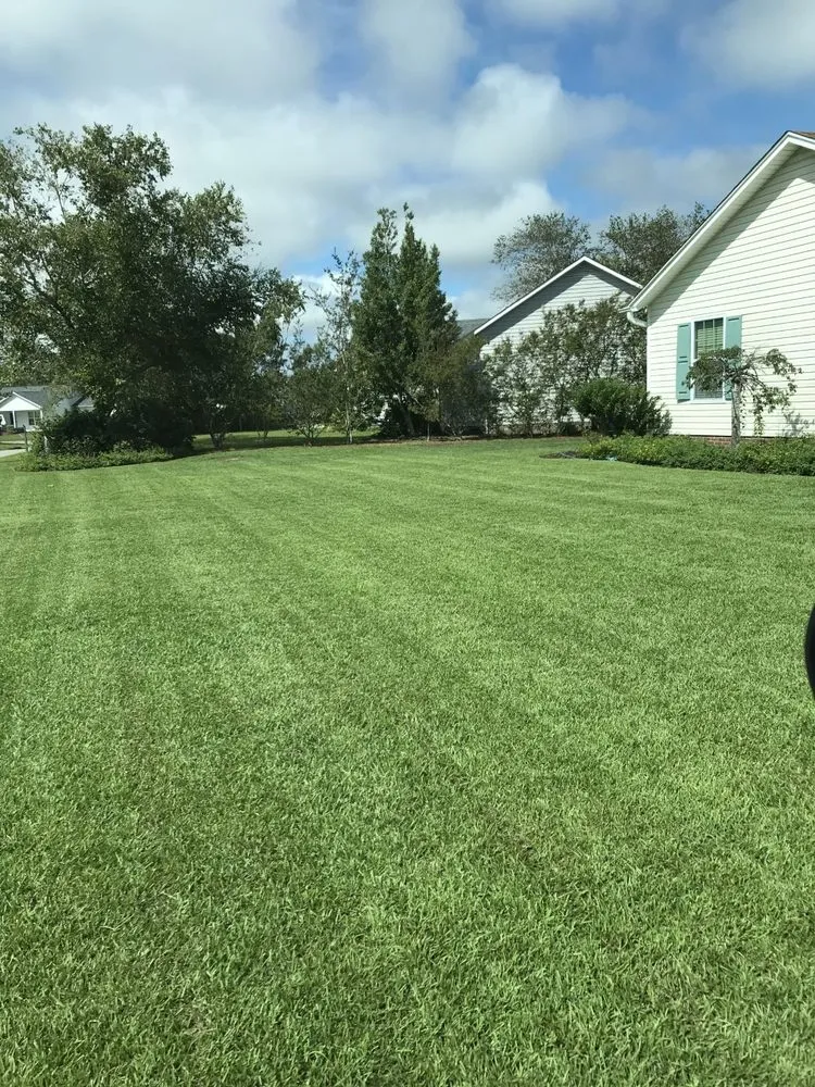 Trusted outdoor landscaping with custom design in Shallotte, NC by Barefoot Lawn Care