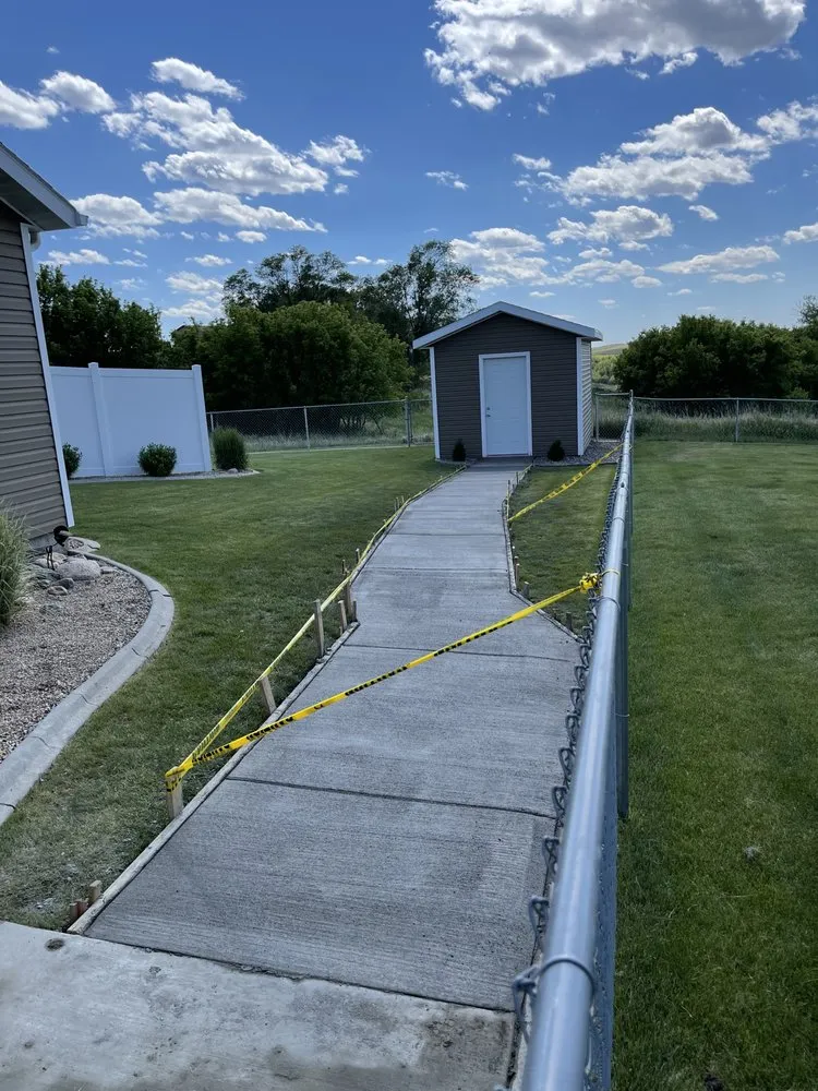 Expert yard cleanup service with custom design in Mandan, ND by Barn Cat Construction