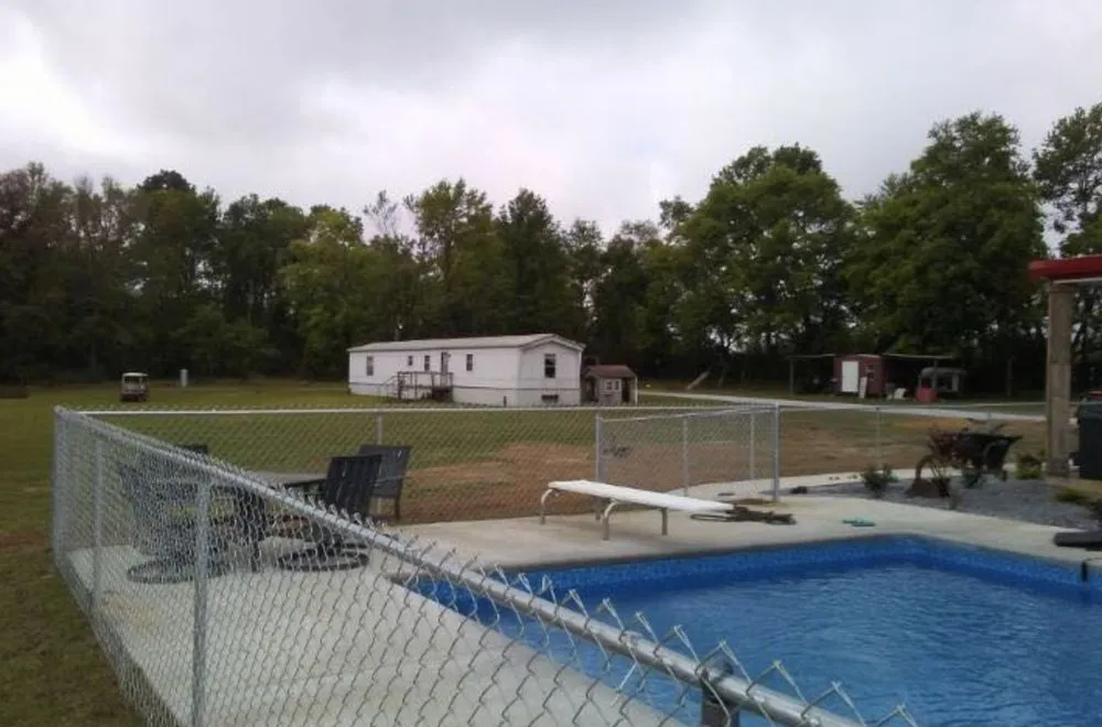 Top-rated lawn mowing service in Graceville, FL by Barnes Family Fencing