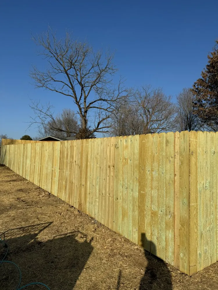 Professional lawn mowing service in Fayetteville, AR by Barrier Solutions