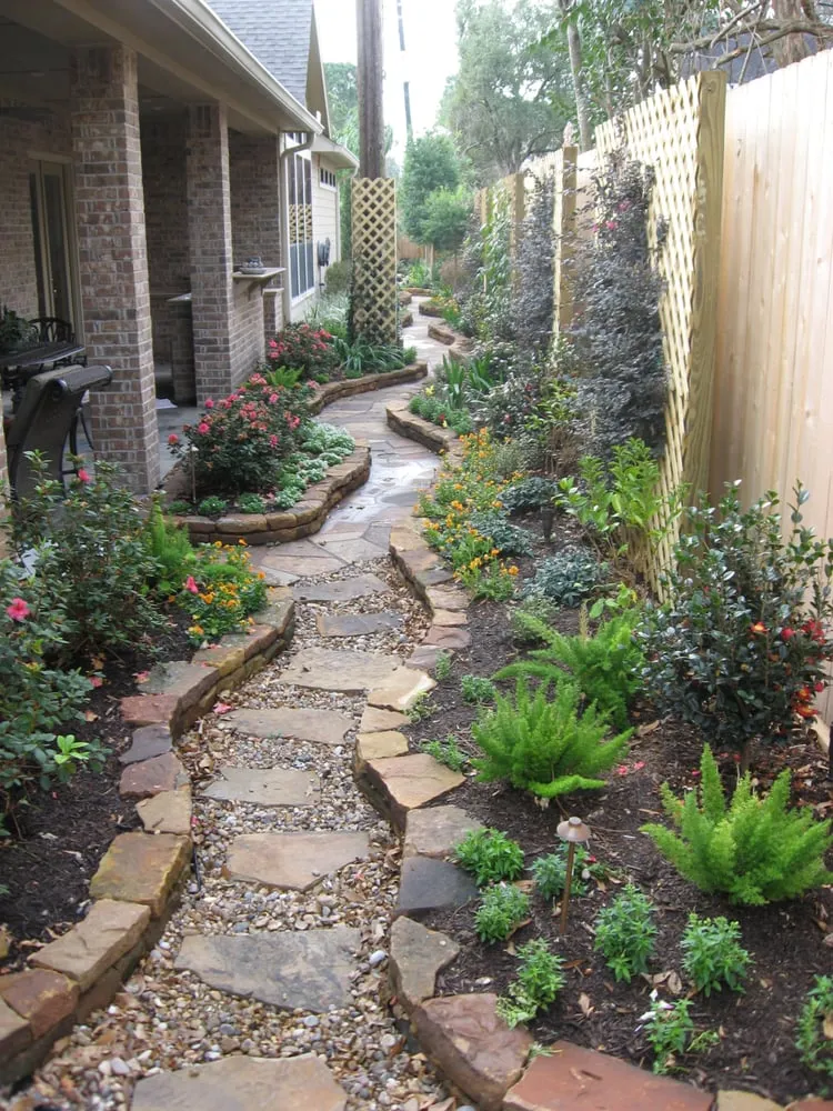 Professional yard maintenance for residential properties in Houston, TX by Bayside Landscape Services