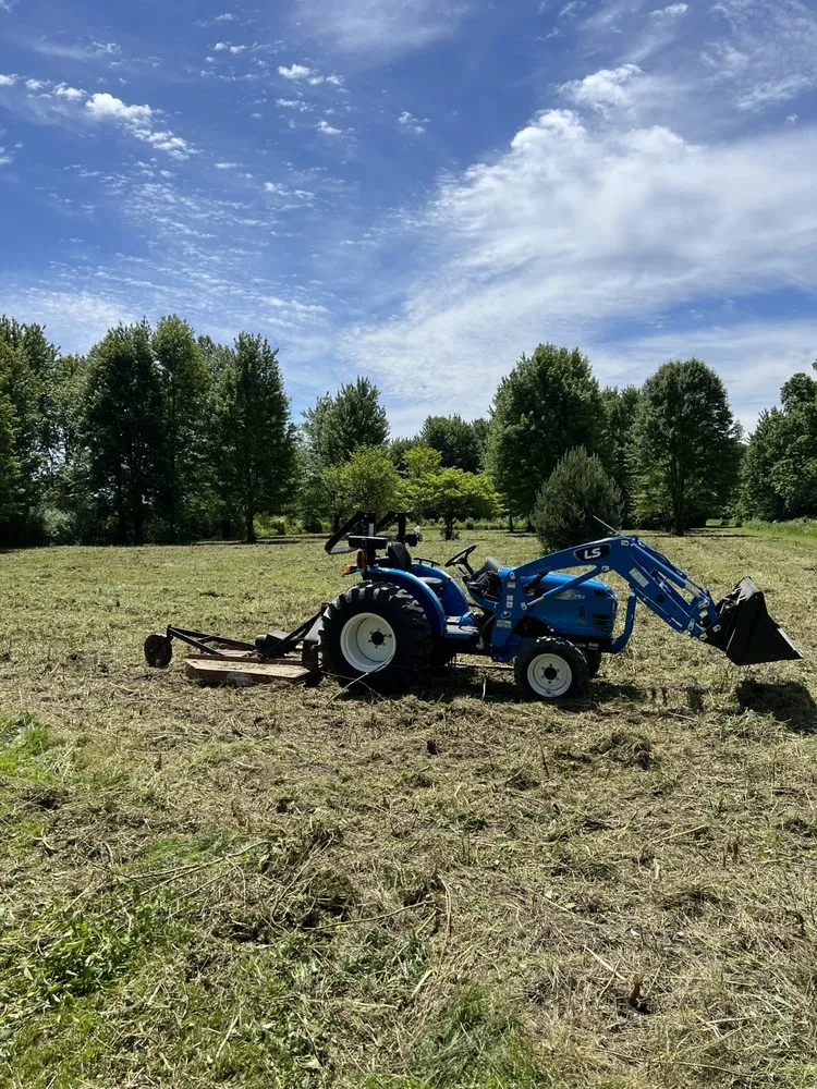 Affordable yard cleanup service for year-round maintenance in Emmett, MI by Bear Down Tractor Services
