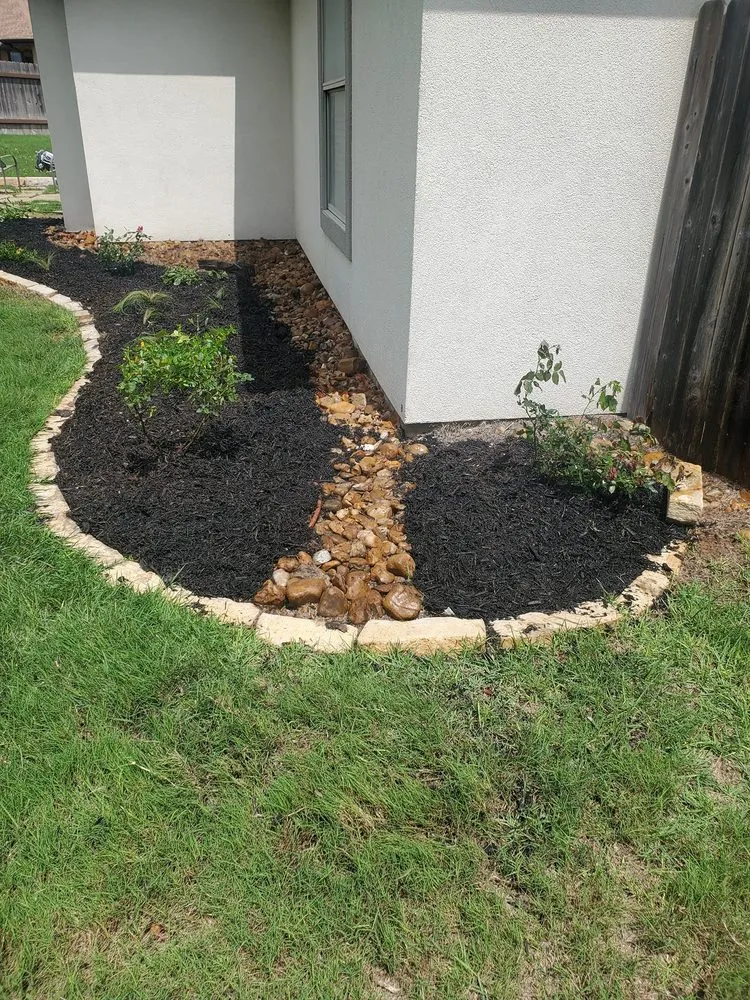 Custom yard cleanup service with custom design in Stockdale, TX by Bear Landscaping