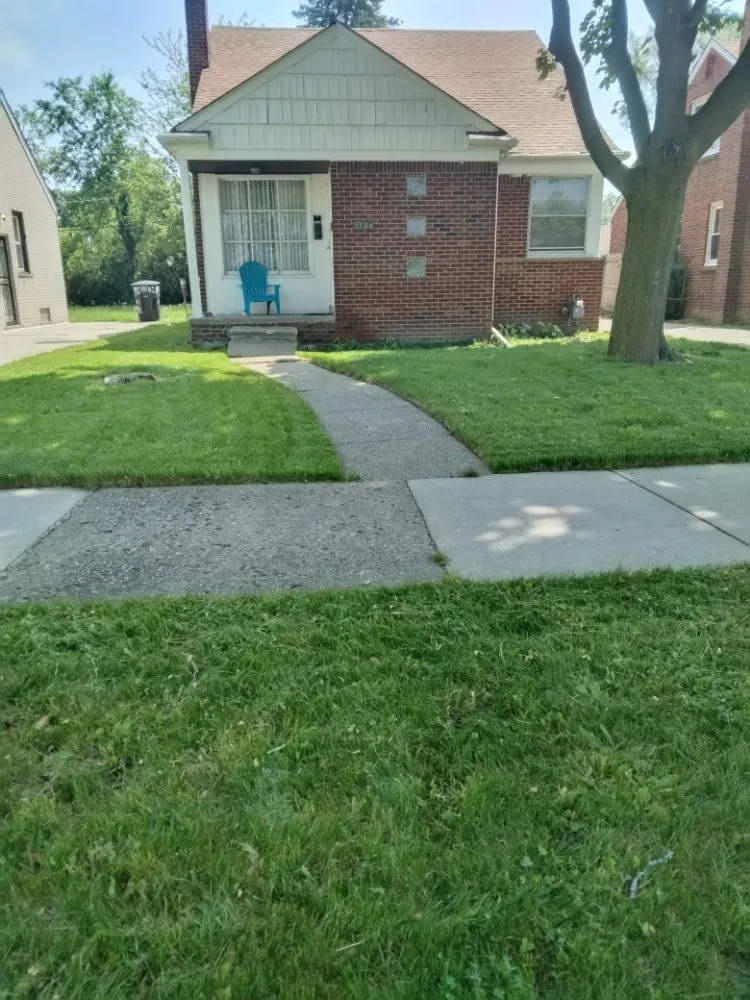 Reliable lawn mowing service for homes in Detroit, MI by Beauchamps Landscaping