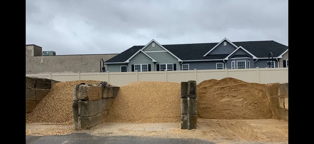 Affordable lawn mowing service for year-round maintenance in West Babylon, NY by Bedrock Landscape Material