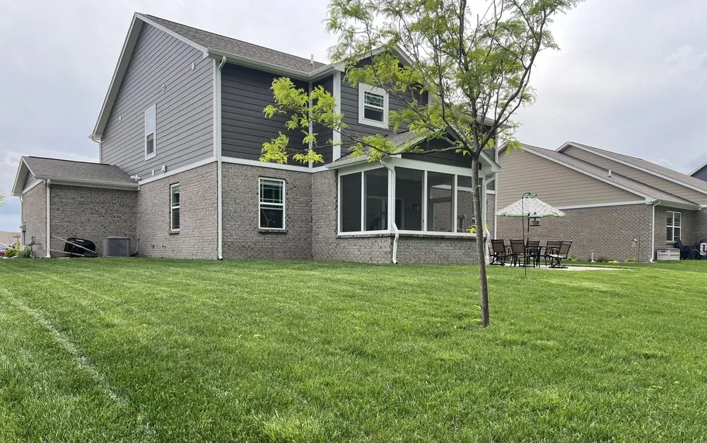 Custom lawn mowing service for residential properties in Carmel, IN by Bee Green Organic & Traditional Lawn & Plant Healthcare