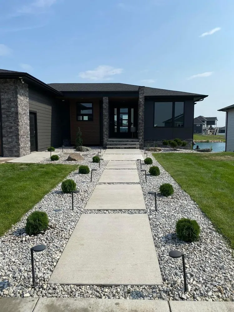 Professional landscape installation for residential properties across Sioux Falls, SD - Benson's Lawn and Landscaping