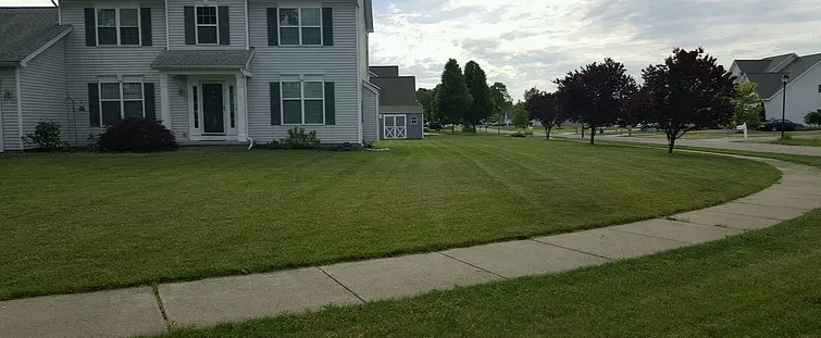 Professional yard cleanup service for homes in Rochester, NY by Best Care Lawn Maintenance