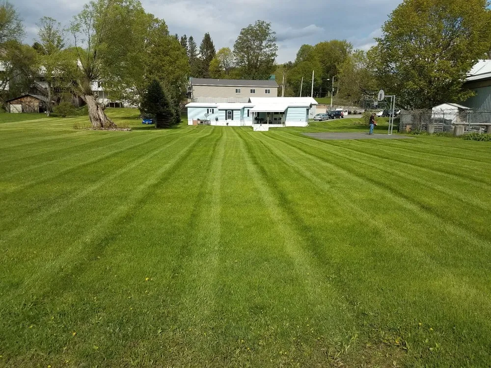 Professional lawn mowing service in Newport, NY by Best Lawn Care