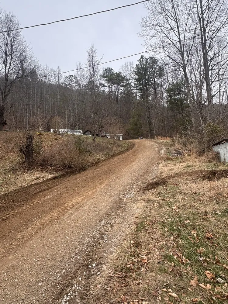Professional yard cleanup service for year-round maintenance in Barbourville, KY by Big Country Hauling and Dirt Work
