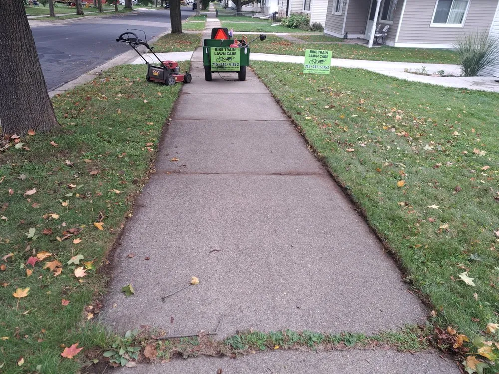 Expert lawn mowing service for homes in Wausau, WI by Bike Train Lawn Care
