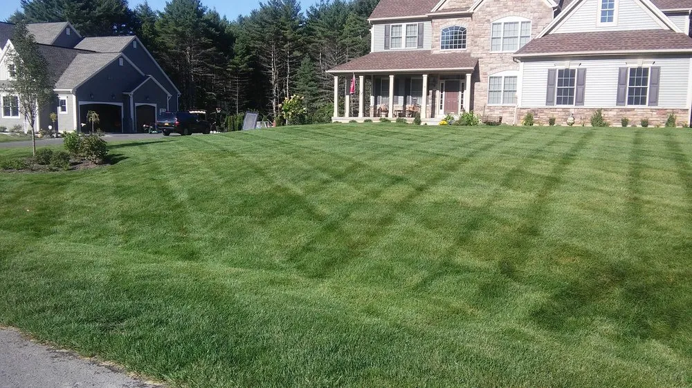 Custom garden landscaping with custom design in Richmondville, NY by Bio Green of Upstate NY