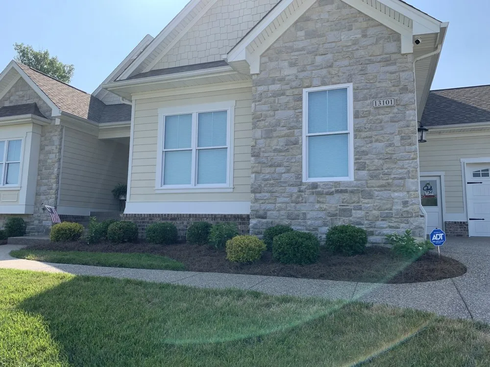 Professional landscaping services for residential properties in Louisville, KY by Bischoff Outdoor Services