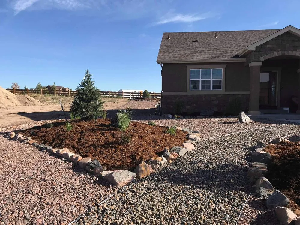 Trusted lawn mowing service for year-round maintenance in Colorado Springs, CO by Black Diamond Landscapes