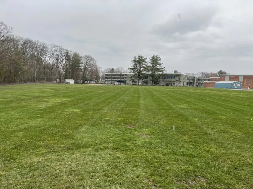 Professional lawn care service for residential properties in Medway, MA by Black Dog Landscapes