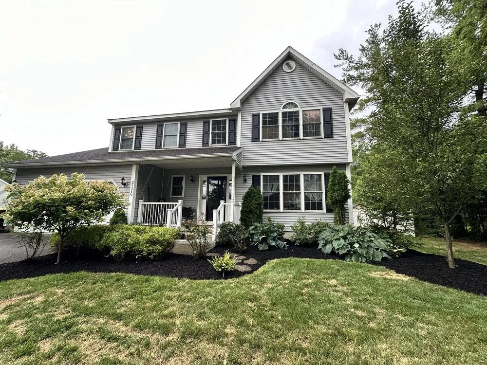 Custom landscape installation with custom design in Schenectady, NY by Blade Runner Lawn Care