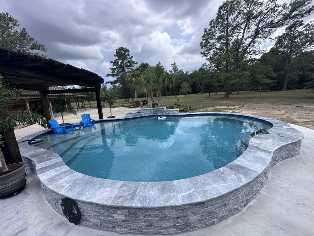 Custom landscape installation in Beaumont, TX by BlueFin Pools