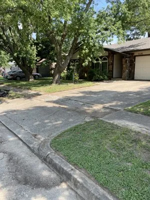 Boomin' Greens Lawn Care Logo