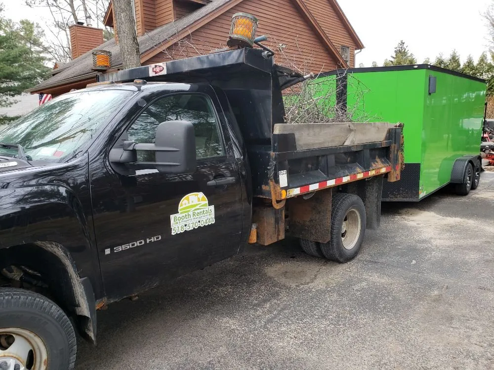 Professional lawn mowing service for year-round maintenance in Plattsburgh, NY by Booth Rentals & Property Management