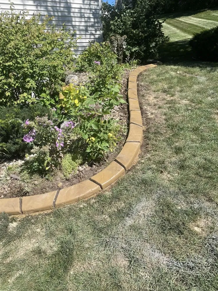Professional yard maintenance with custom design in Waunakee, WI by Border Magic by BB Landscaping