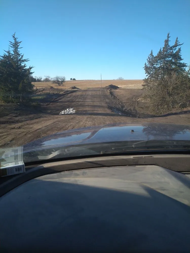 Custom landscape installation for homes in Tecumseh, NE by Borrenpohl Skid Steer