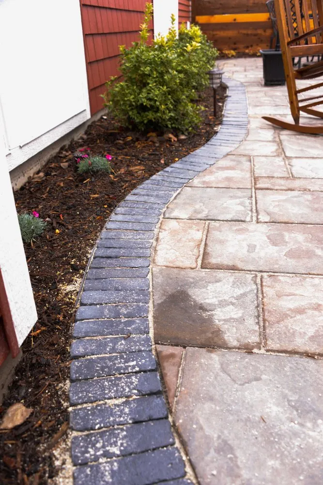 Custom landscape installation with custom design in Holland, MI by Bosch's Landscaping & Lawn Specialties