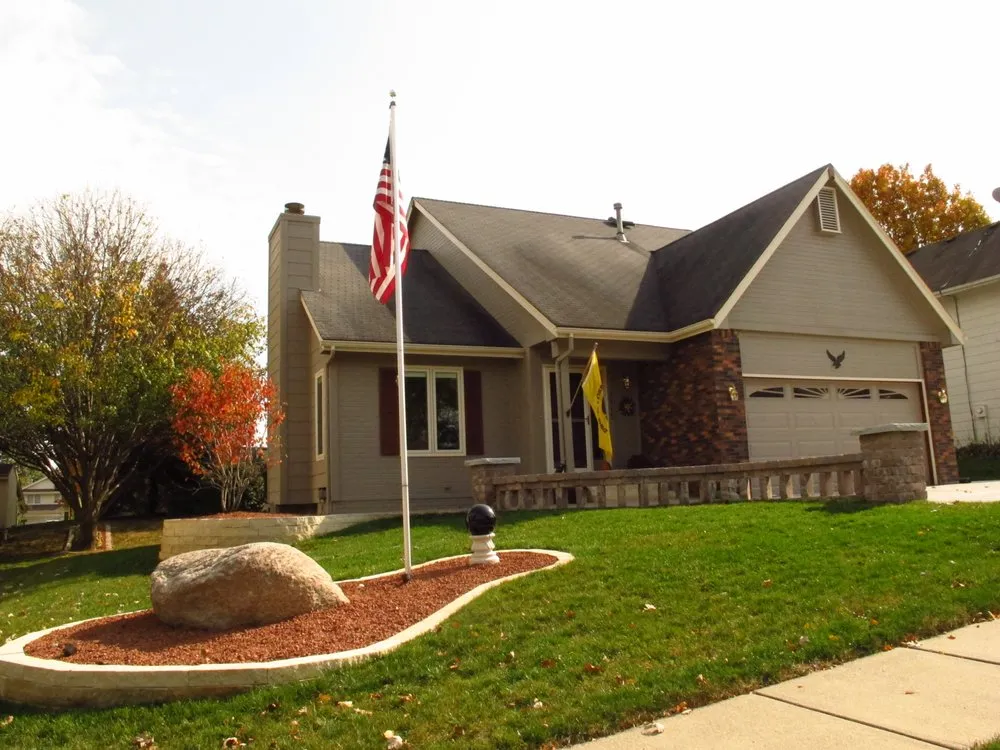 Professional lawn care service for beautiful yards in Johnston, IA by BOSS Complete Outdoor Solutions