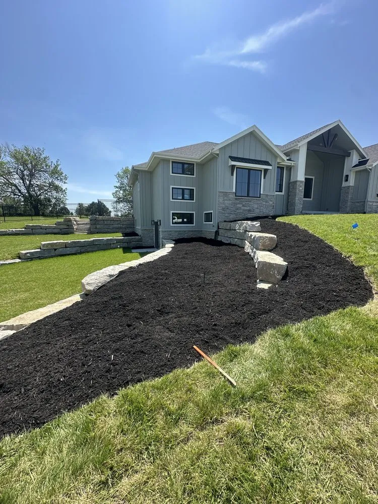 Custom garden landscaping for year-round maintenance in Omaha, NE by Bravo Landscaping