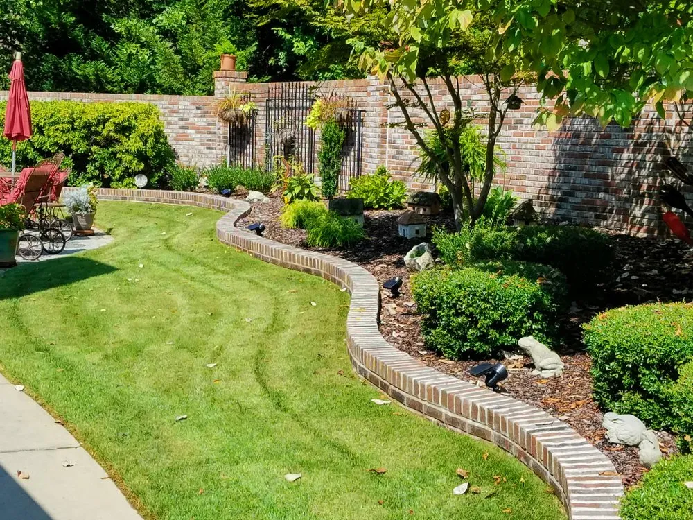 Reliable lawn mowing service with custom design in New Market, AL by Briggs Outdoor Construction