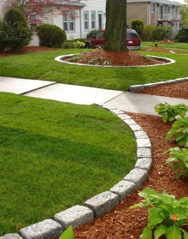 Reliable lawn mowing service for year-round maintenance across Needham, MA - Bros Construction & Landscaping