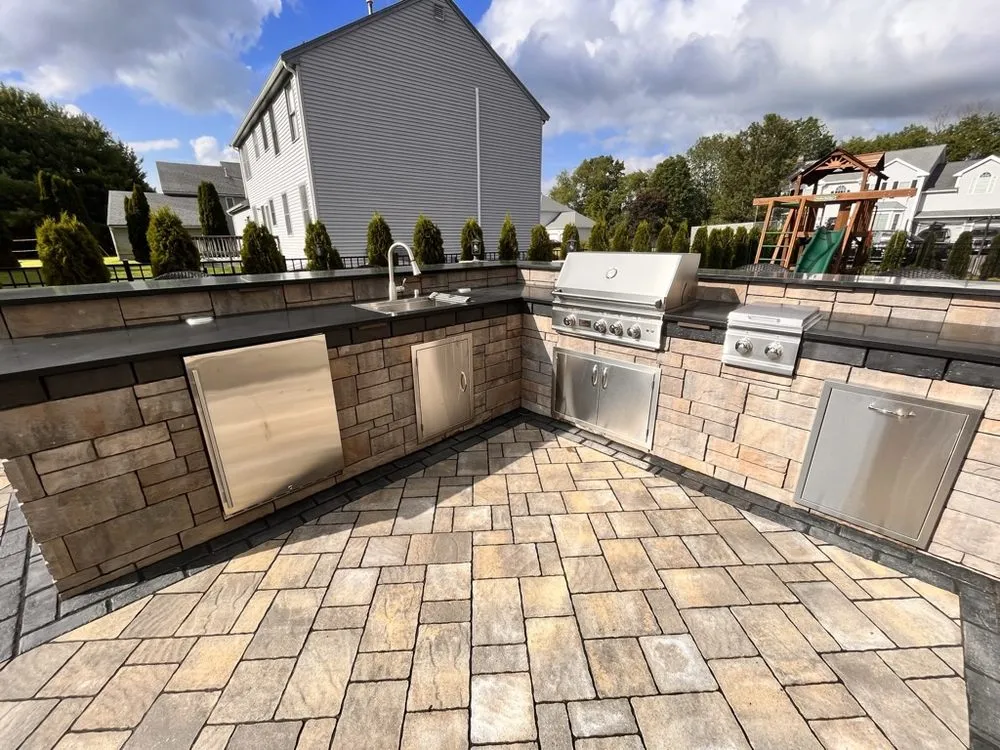 Affordable lawn mowing service for homes in Canton, MA by Brothers Landscapers