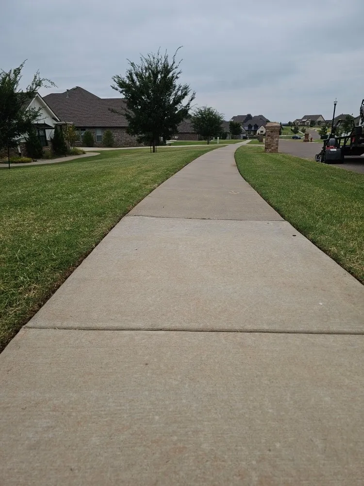 Custom lawn mowing service for residential properties in Norman, OK by Brothers Outdoor Services
