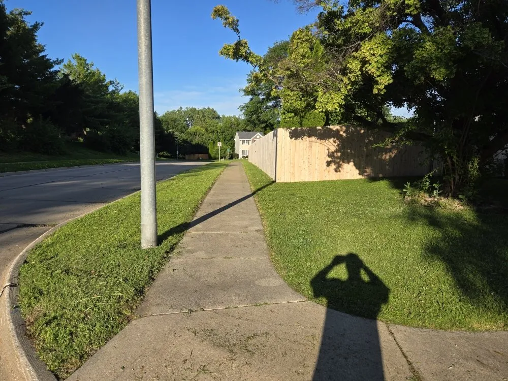 Custom landscape design for outdoor upgrades in Carlisle, IA by Bryson's Lawn Care Service