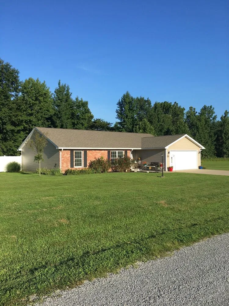 Custom landscaping services for residential properties in Carterville, IL by Buehler Brothers Lawn Service