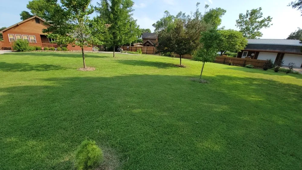 Professional outdoor landscaping with custom design in Caney, KS by Bullpup lawn services
