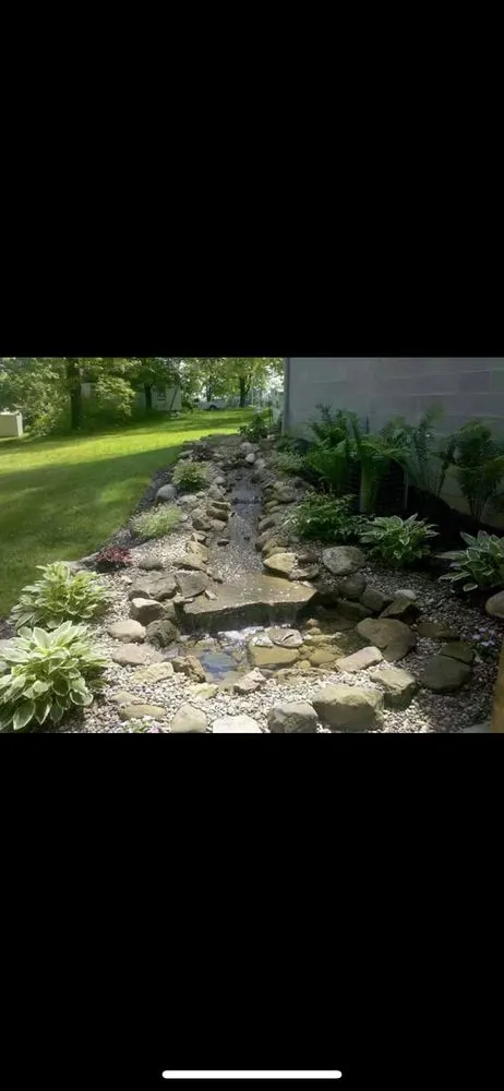 Professional yard cleanup service for year-round maintenance in Louisville, OH by Burick Landscaping